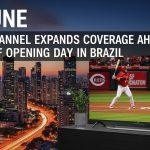 TV screen displaying a Reds game with a Brazilian city skyline in the background